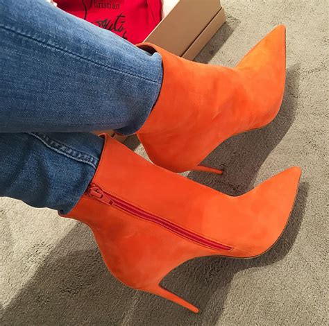 orange high heel boots.